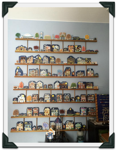 Gail fills a wall with ladders to show off her Cat's Meow Halloween collection.