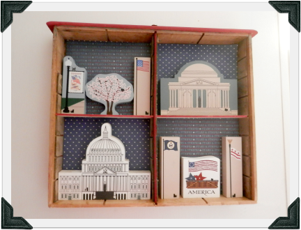 Annette upcycled a vintage cupboard drawer to display her Washington D.C. Cat's Meow collection in