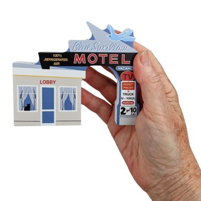 Souvenir replica of the Blue Swallow Motel in Tucumcari, New Mexico. Handcrafted in 3/4" thick wood by The Cat's Meow Village in the USA.