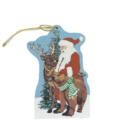 Wilderness Santa ornament to adorn your holiday tree. Handcrafted by The Cat's Meow Village of 1/4" thick wood, plus string ready to hang.