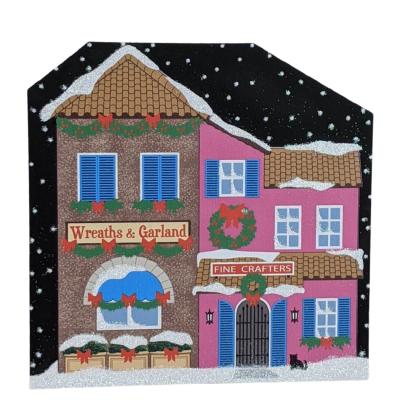 North Pole, Wreaths & Garland Fine Crafters handcrafted in 3/4" thick wood by The Cat's Meow Village in Wooster, Ohio.