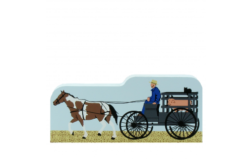 Amish man taking his pig to auction day. Handcrafted in 3/4" thick wood by The Cat's meow Village in the USA.