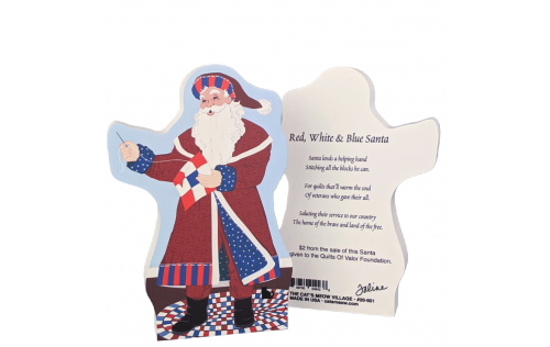 Red, White and Blue Santa is stitching up a patriotic 9 patch quilt block. Handcrafted in Wooster, Ohio by The Cat's Meow Village.