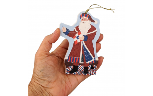 This Red, White & Blue Santa ornament celebrates quilting and American veterans! Handcrafted by The Cat's Meow Village in Wooster, Ohio.