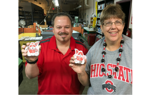 OSU  fans, Tony and Diane, show off their personalized football fan Snowmen ornaments