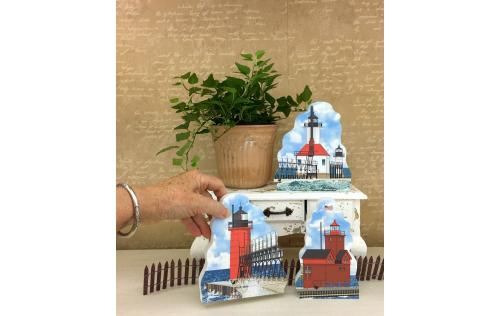St. Joseph North Pier, Big Red, and South Haven lighthouses shown together as an example of how you can display them in your home. Handcrafted in the USA by The Cat's Meow Village.
