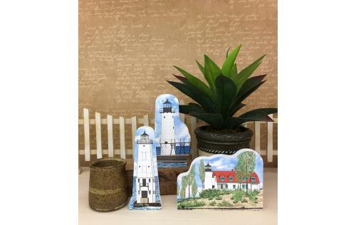 Manistee North Pierhead, Frankfort North Breakwater and Point Betsie lighthouses shown together as an example of how you can display them in your home. Handcrafted in the USA by The Cat's Meow Village.
