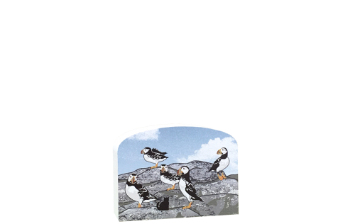 A common sight on the islands off the coast of Maine, Atlantic Puffins are only found here in the United States. Handcrafted wood replica by The Cat's Meow Village.