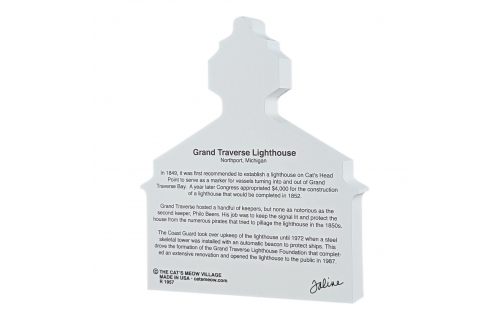 Story on the back of souvenir of Grand Traverse Lighthouse, Northport, Michigan, handcrafted in wood by The Cat's Meow Village in the USA.
