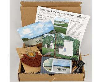 This Cape Cod National Seashore box includes a replica of the Three Sisters Lighthouses along with a macrame car charm and a bottle of DoTERRA Wild Orange essential oil.