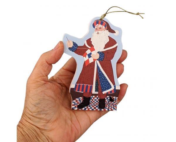 This Red, White & Blue Santa ornament celebrates quilting and American veterans! Handcrafted by The Cat's Meow Village in Wooster, Ohio.